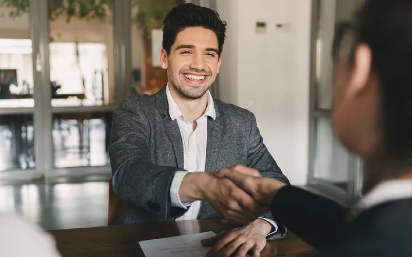 Recruitment consultants reviewing candidate profiles in a Dubai office