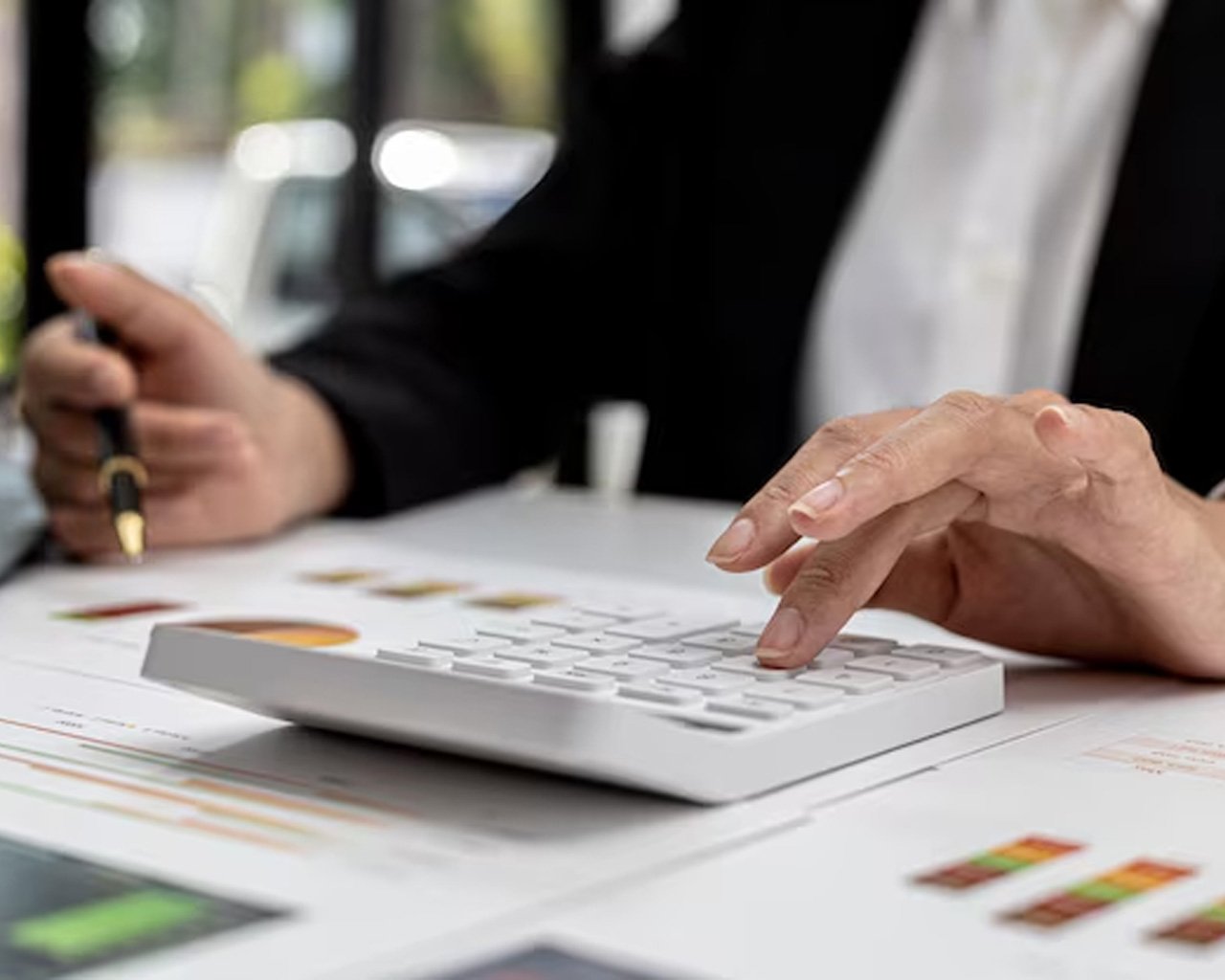 Finance manager calculating hiring costs in UAE